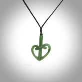 This is a beautiful koru pendant designed with a little inspiration from our national airline, Air New Zealand. It is carved from green jade which we source in Aceh and it is a lovely bright green with some dark speckled inclusions. A wonderful pendant.